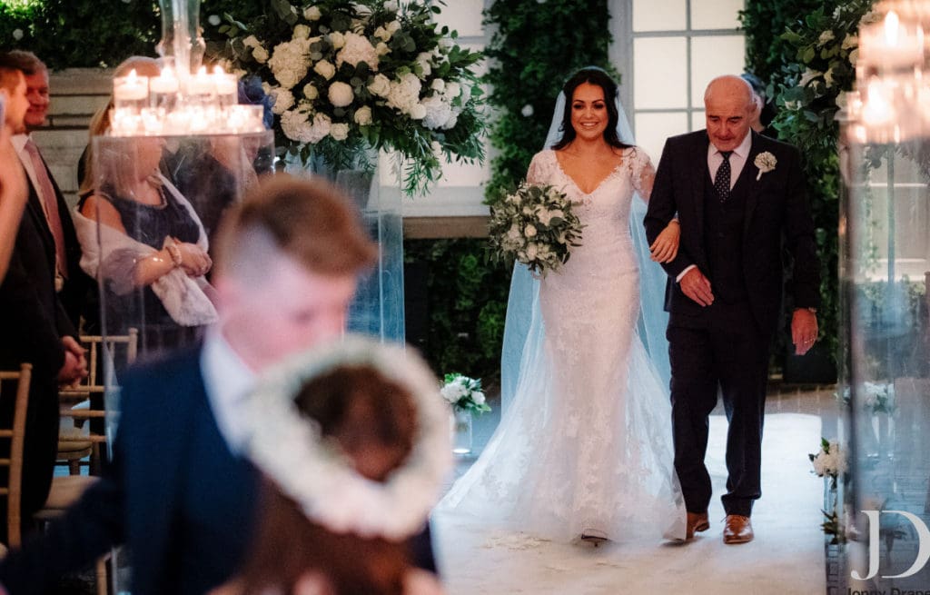 Father walking bride down the aisle