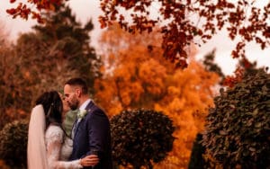 Couple kissing outdoors in the autumn