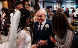 Father Celebrates with Bride