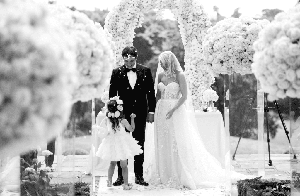 Bride and groom with flower girl