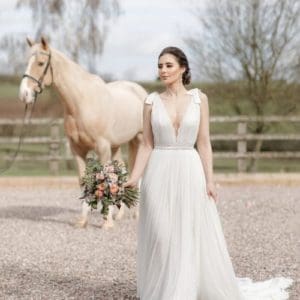 Bride with horse in the background
