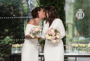 Brides kissing after being married
