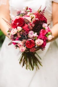 a red coloured wedding bouquet