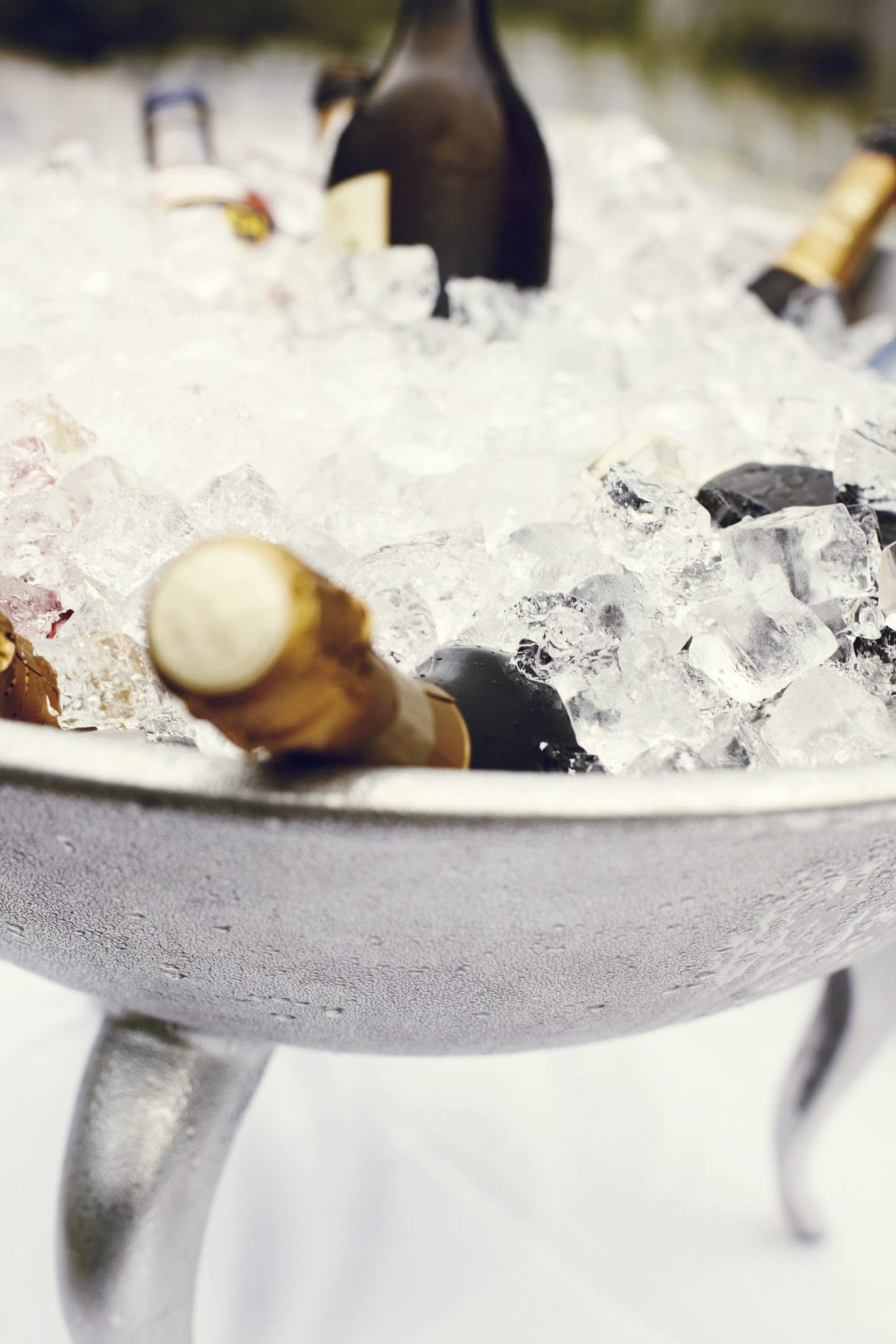 Image describes champagne on ice.