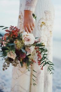 Bride with flower bouquet.