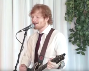 Ed Sgeeran singing at a wedding
