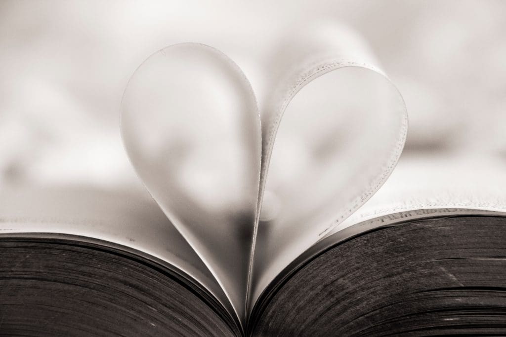 Wedding readings in a heart shape from a book.
