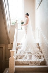 Bride on the steps at Delamere Manor