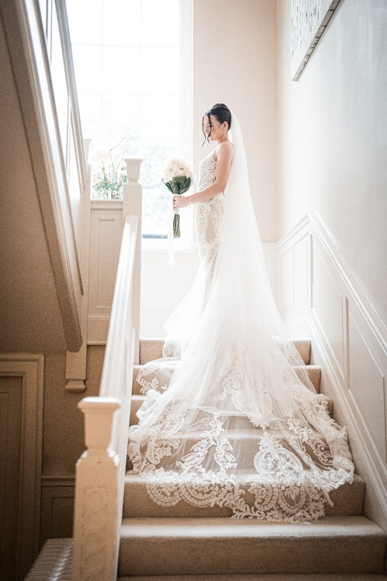 Bride on the steps at Delamere Manor