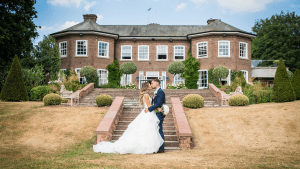 Couple Kissing infront of Delamere Manor