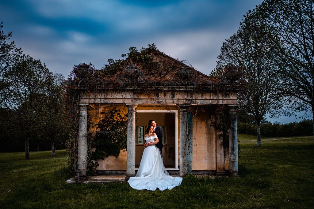 Bride & Groom Outside the Summer house at Delamere Manor